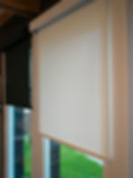 Cream and black window treatment blinds