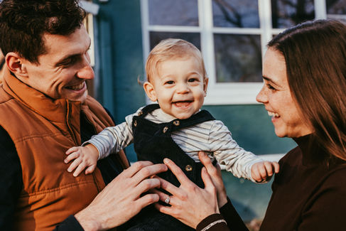 A family laughing and having fun at a family photo session in Kansas City MO