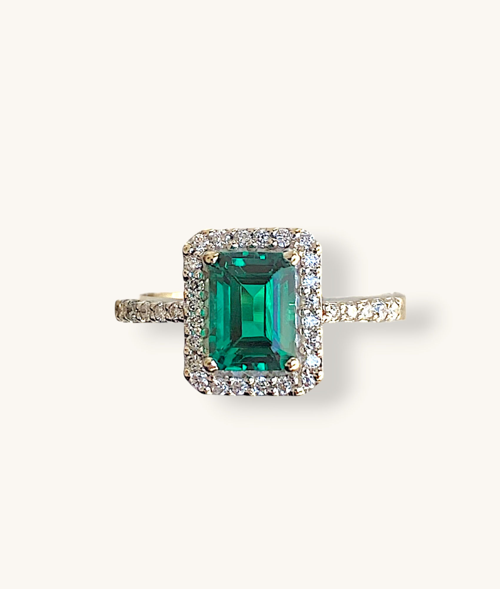 18K SYNTHETIC EMERALD CUT EMERALD AND DIAMOND HALO RING