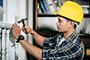 carpenter-holds-hammer-nails.jpg