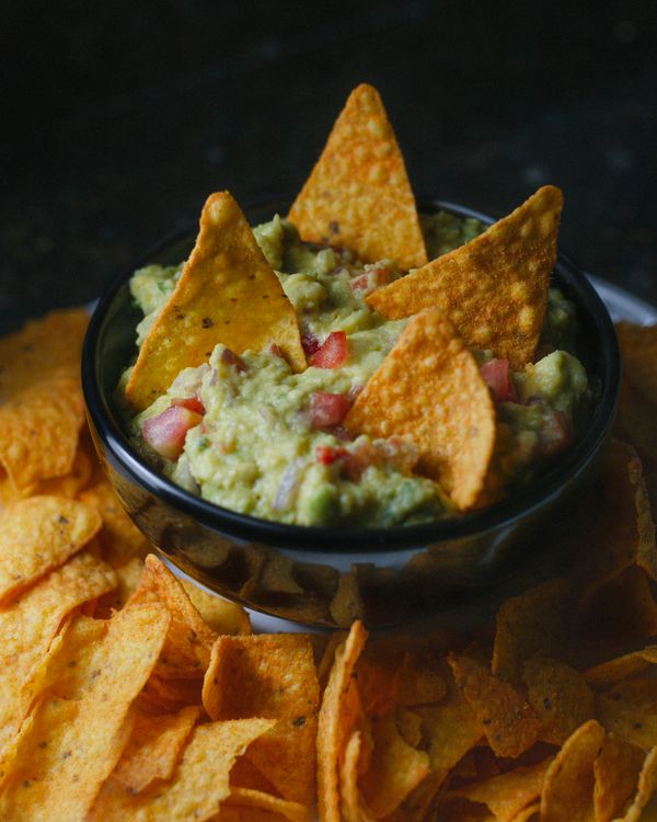 Fresh chunky guacamole served with tortilla chips