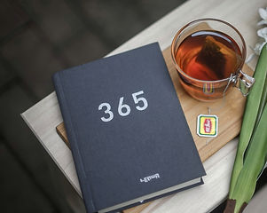 365%20book%20beside%20clear%20glass%20mug_edited.jpg