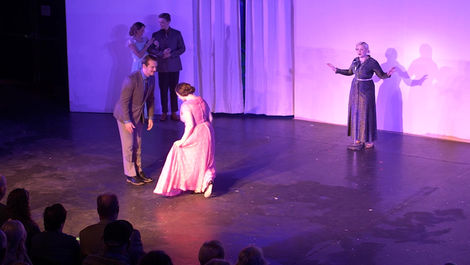 young couple about to start a waltz together