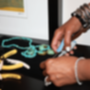 G. Denise Barksdale at work in her studio crafting her jewelry