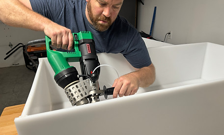 Man welding a polypropylene tank with Leister Fusion 3