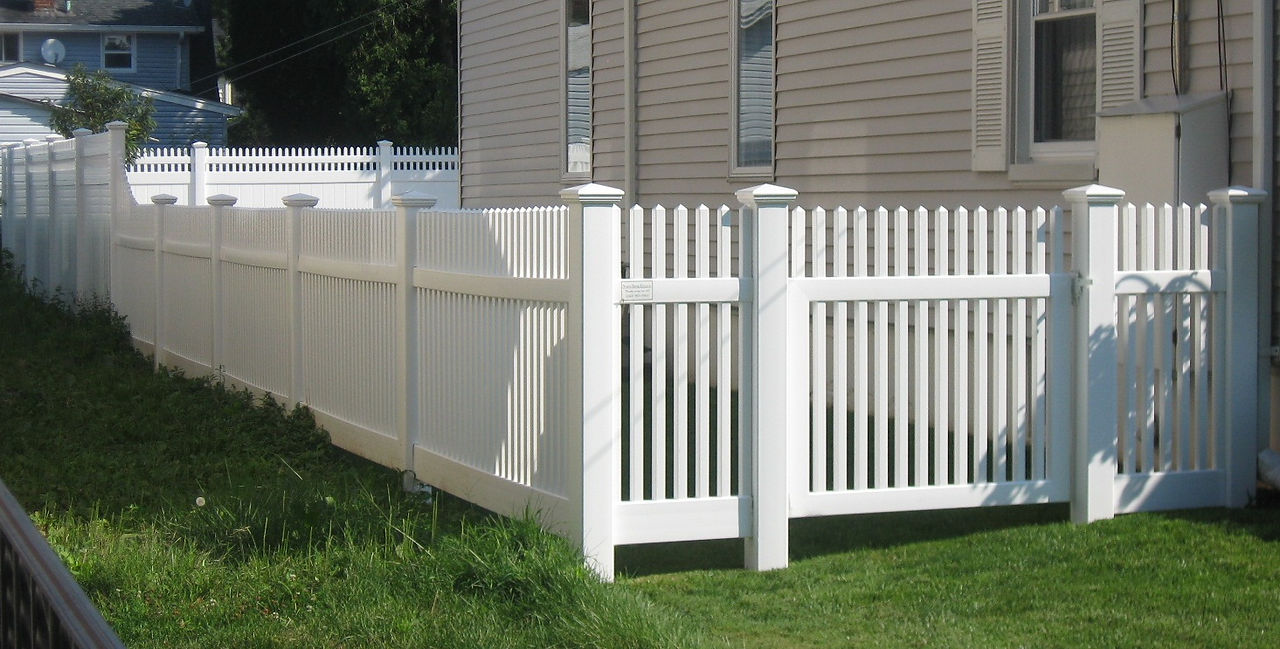 White vinyl picket fence with gate; Vinyl Fencing Gallery – Durable, Clean, and Low Maintenance