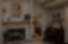 Banner image of ComfortCare Homes fireplace with artwork.