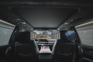 Interior view of blue Cadillac Escalade rental