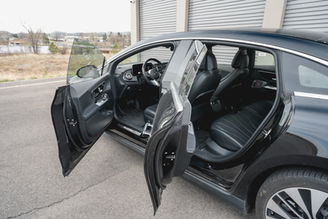 Rear view of black Mercedes Benz EQE rental