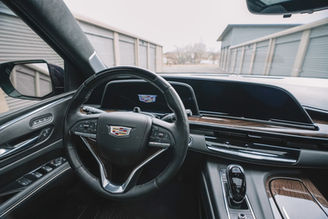 Interior view of blue Cadillac Escalade rental
