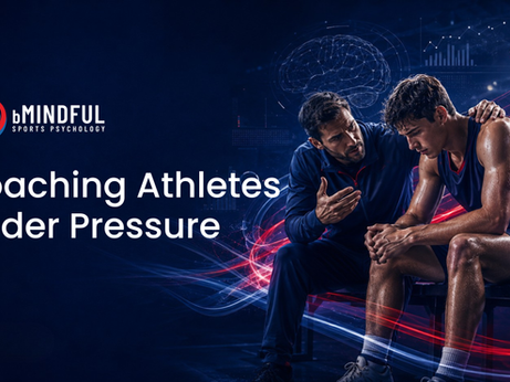 An athlete is sitting down looking stressed a coach is sitting next to them talking 