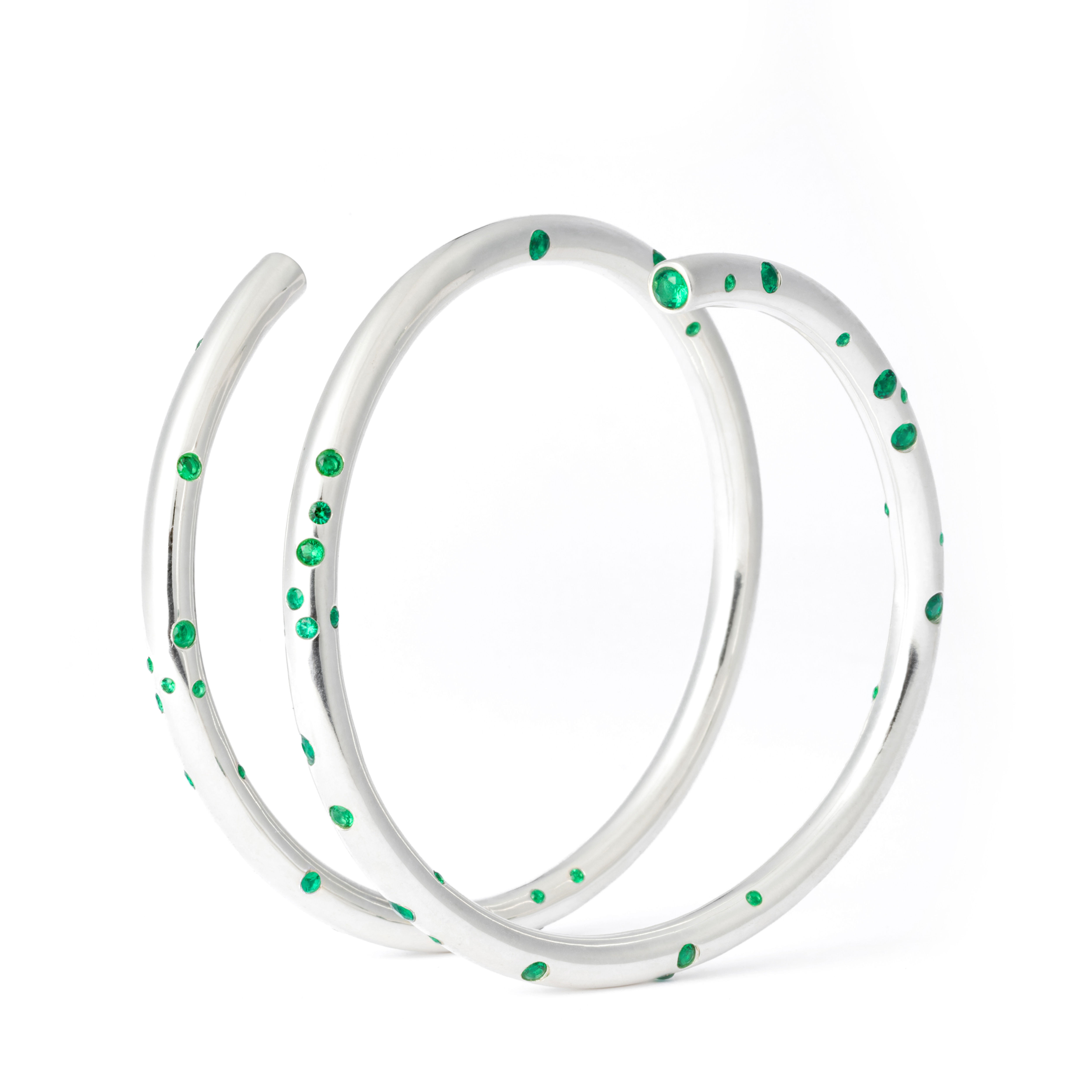Twisting sterling silver hand cuff set with multiple green diamonds from Astrongal Jewellery