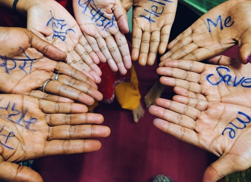 Survivors practiced writing messages on their hands as a discreet way to signal for help in the event of being trapped in a dangerous situation.