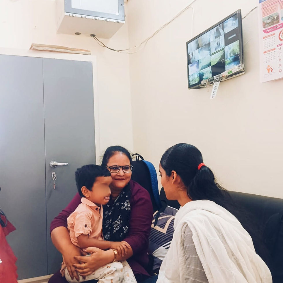 Hanifa (right), her son, and our social worker