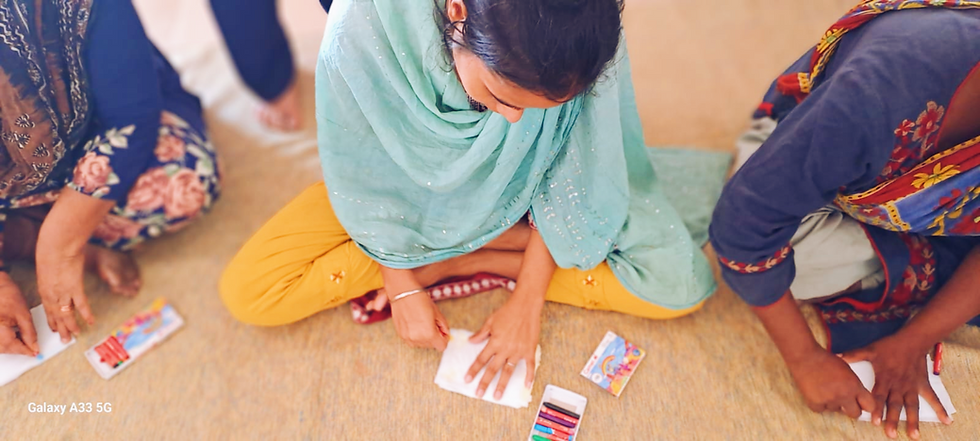 Shabana makes paper flowers in the shelter home