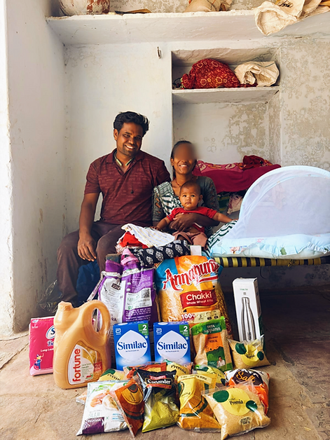 Sanchi with her baby, husband, and supplies from our social workers