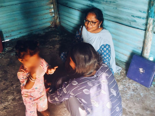 Keona and baby with social worker