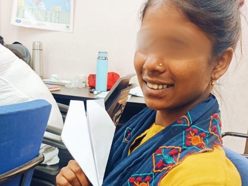 Mazina shows us a paper airplane she made