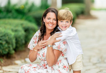 mother and son taking a portrait in Alys Beach, Florida