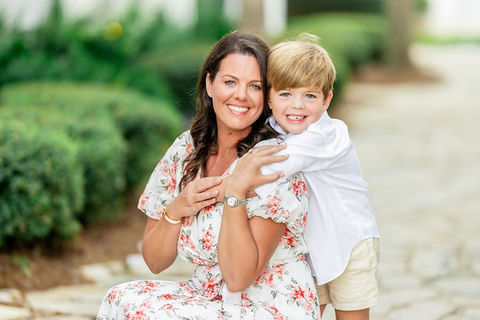 mother and son taking a portrait in Alys Beach, Florida