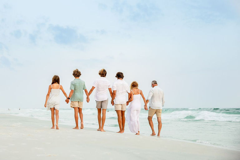 family walking down Rosemary Beach for family photos