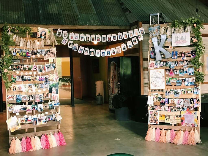 Pallet wall room divider for pictures to display at graduation party.