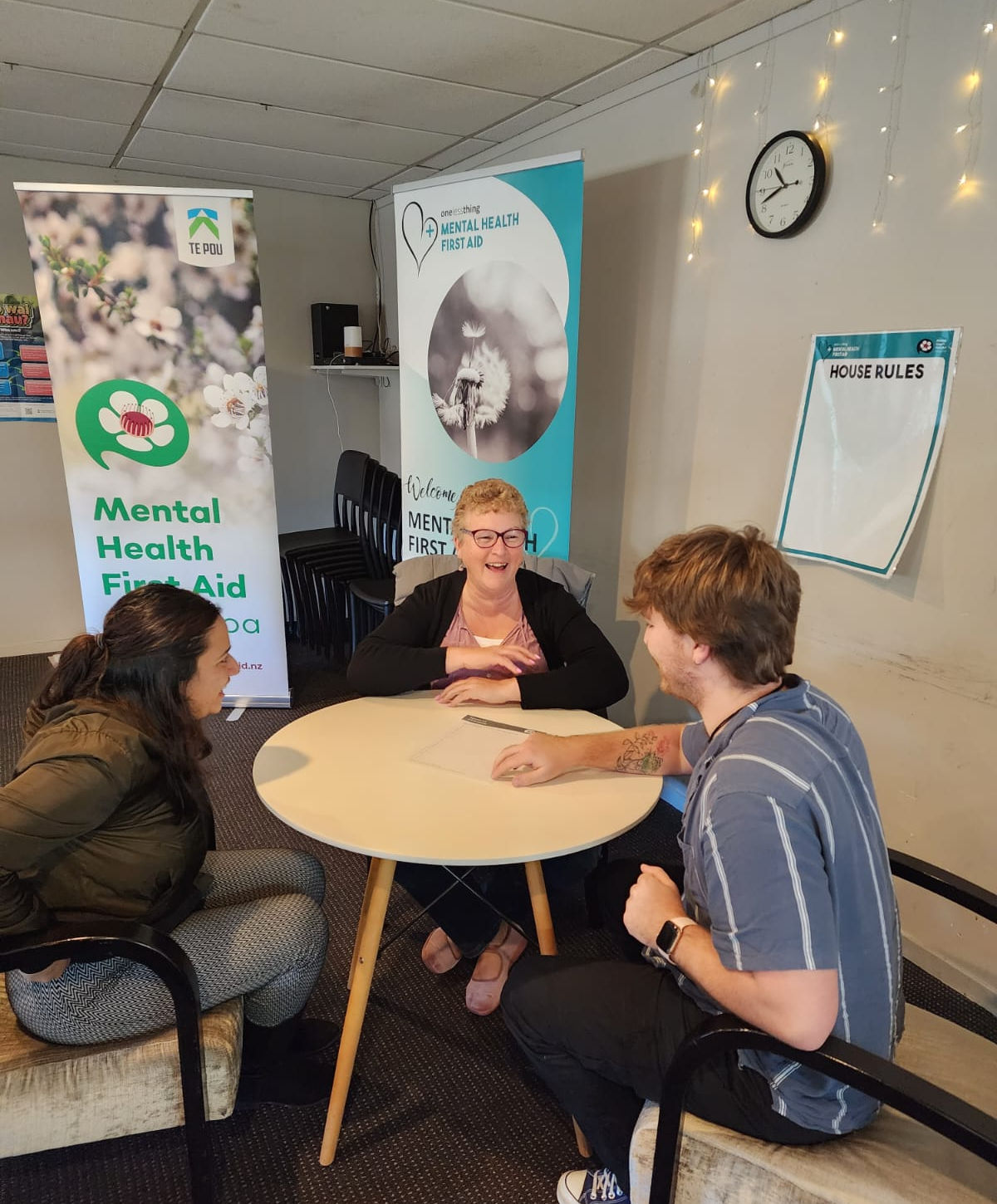 Focused participants in a workshop dedicated to mental health awareness, strategies, and holistic well-being.