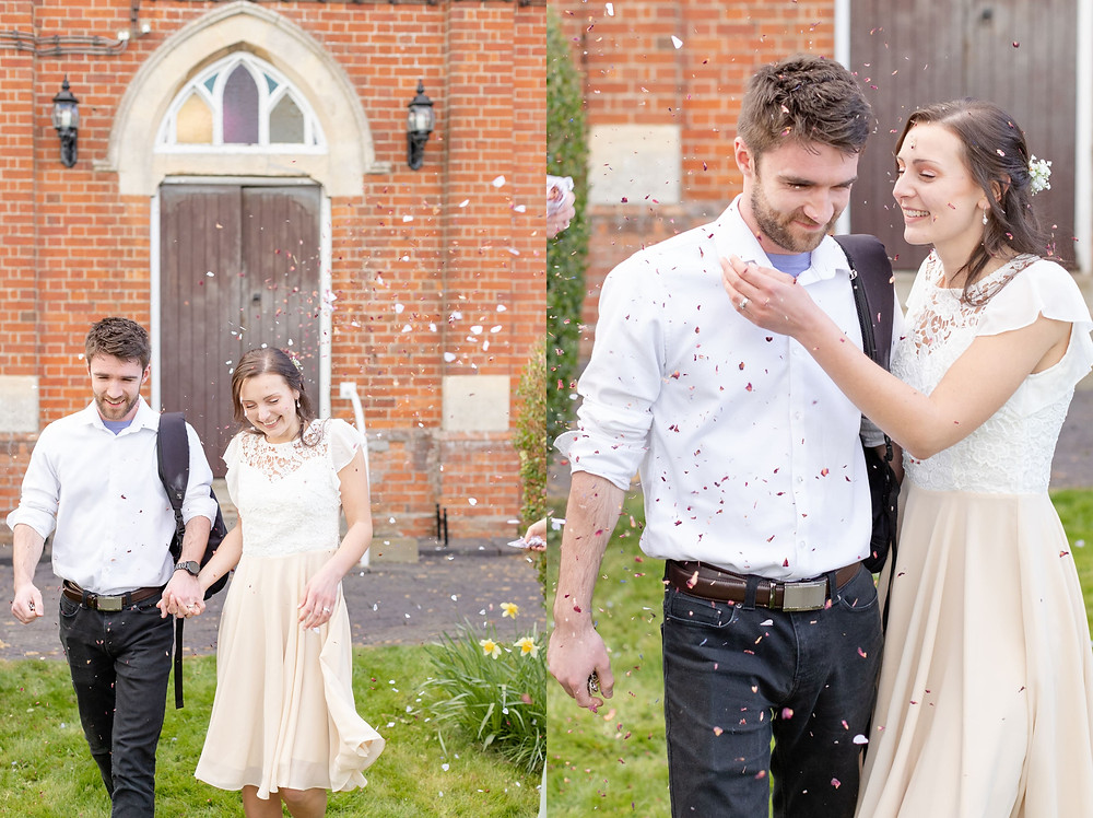 Bride and groom laugh as they leave their wedding surrounded by guests throwing biodegradable confetti