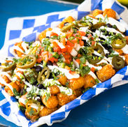 Crispy tater tots covered in queso, jalapeños, pico, black beans and sour cream.