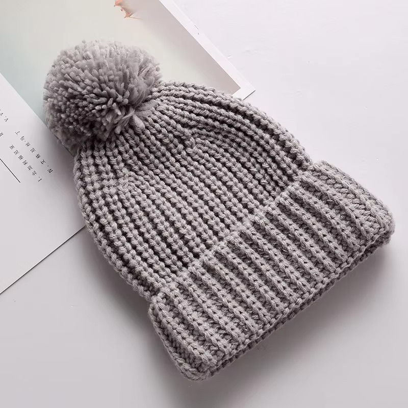<img src="personalized-knit-hat.jpg" alt="Personalized knit hat with name embroidery in beige, mustard, and white colors">