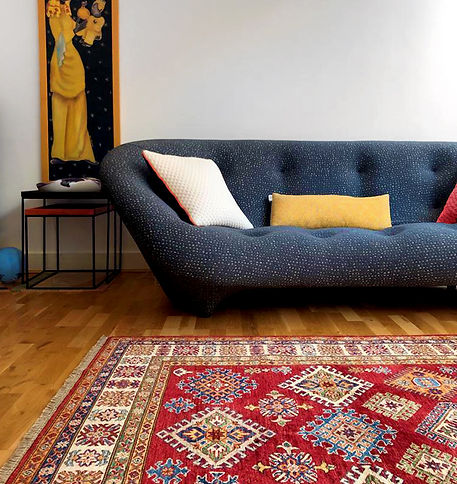 A Bold Afghan Rug In Space With Powerful Colour Palette