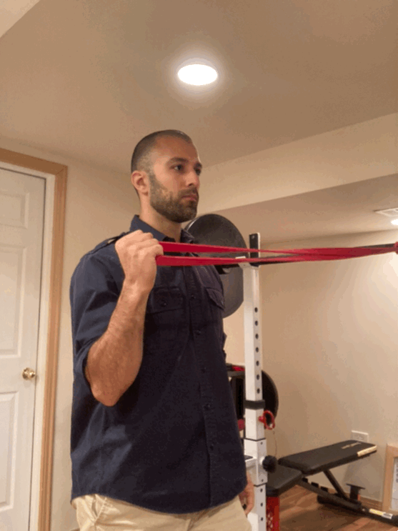 Using a superband, keep the anchor toward the midline. Raise your arm over your head while keeping tension against the band all the way through.