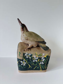 Woodpecker with blackberry flower stand