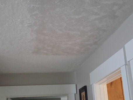 Freshly finished and textured drywall ceiling repair drying before paint in Springville, Utah.