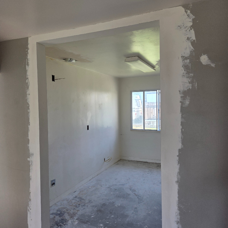 Skim coat being applied over the repaired areas, getting ready for the final coat and the primer finish.