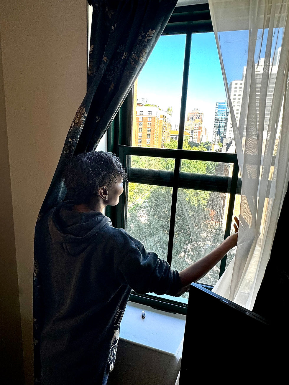 Vernesha taking in the view from her new apartment.