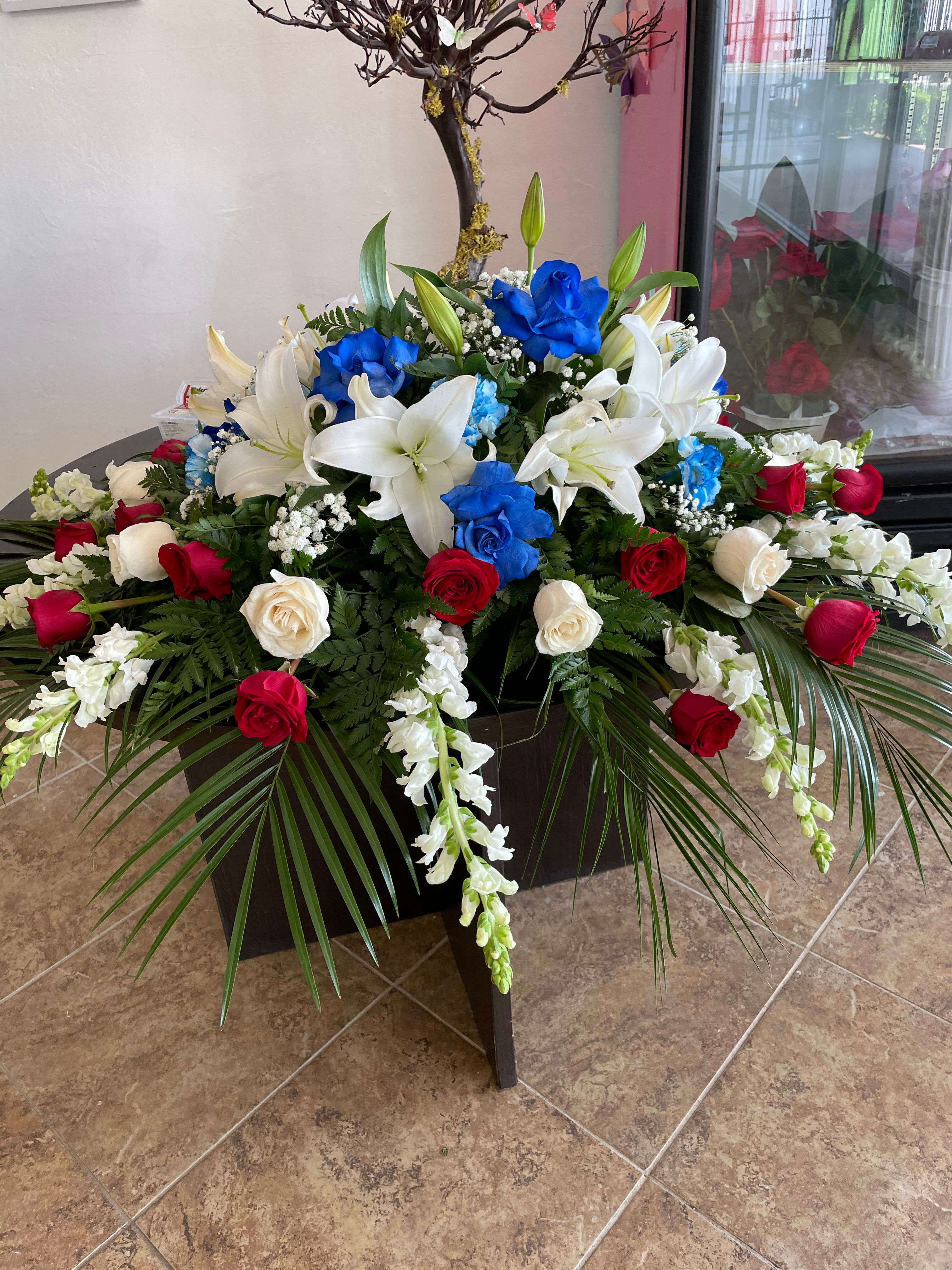 Casket spray blue & red