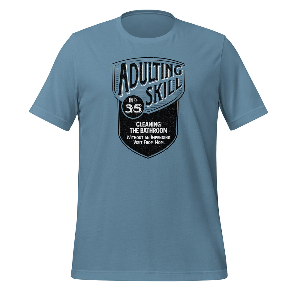 Thumbnail: Steel blue t-shirt featuring bold text: 'Adulting Skill No. 35, Cleaning the Bathroom.'