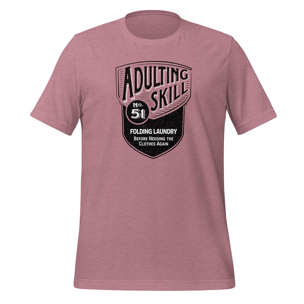 Thumbnail: Orchid t-shirt with a black shield design that reads Adulting Skill 51, Folding Laundry Before Needing The Clothes Again.