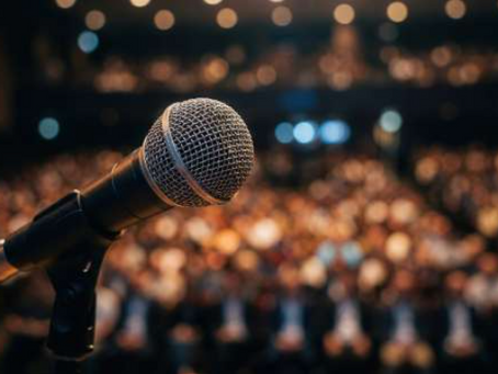 Photo of a microphone in a blurry public background