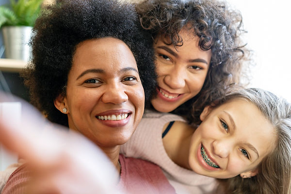 Foster mom with two smiling children