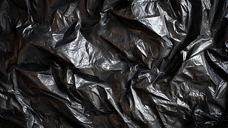 Crumpled black plastic texture