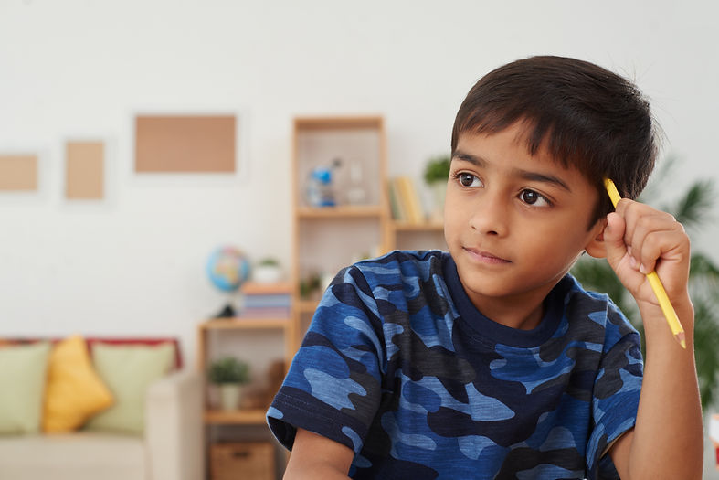 Asian boy thinking
