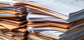 Large stack of white and manila envelopes