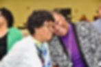 Freedom Reigns Ministries church members praying and praising