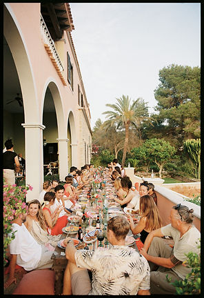 aMallorca wedding table spread with lots of guests enjoying their dinner