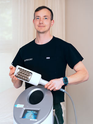 Therapist standing beside Endospheres Therapy machine at Priory Medical Clinic Dublin