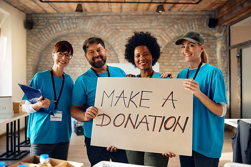 volunteers-holding-a-donation-sign-in-a-building-2026-01-06-10-28-00-utc.jpg