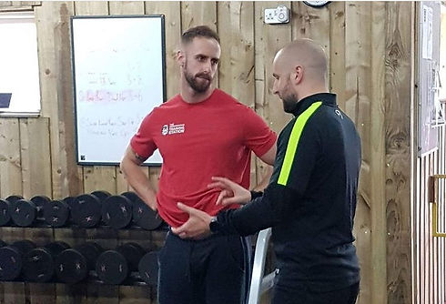 Kristian Weaver coach and mentor talking during a workshop within a gym