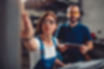 2 people performing confirmation tasks in a factory